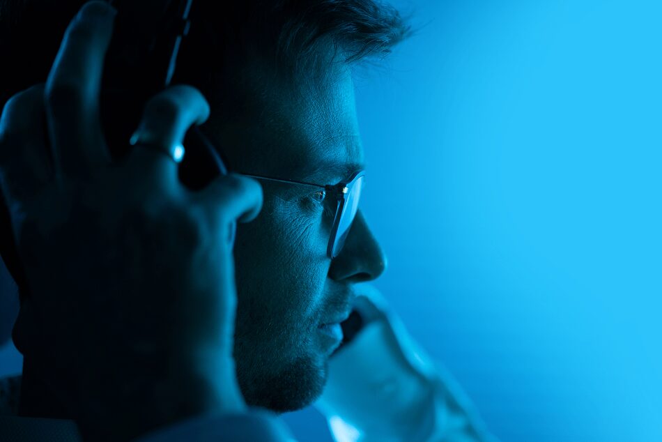 man listening in to data